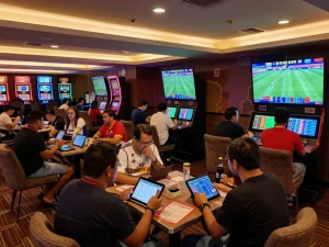 Sports bettors engaging with live matches and stats at bongdalu88 betting lounge.